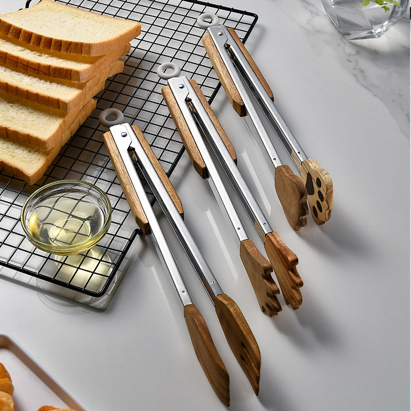 Acacia Wood Food Clip Is Palm Shaped Food Forceps, a Wooden Insulated Handle and a Stainless Steel Clip. It Is Easy to Master and Can Handle a Variety of Delica