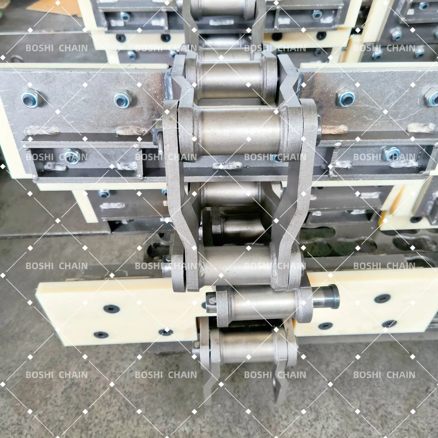 Custom-Welded Bent Plate Chain with Molded Nylon Attachments for Forestry Material Conveyors