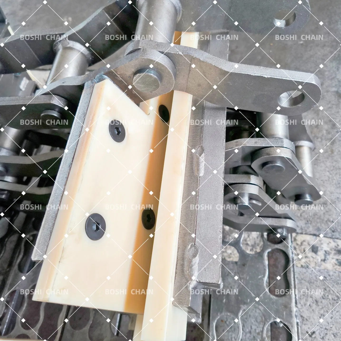 Custom-Welded Bent Plate Chain with Molded Nylon Attachments for Forestry Material Conveyors