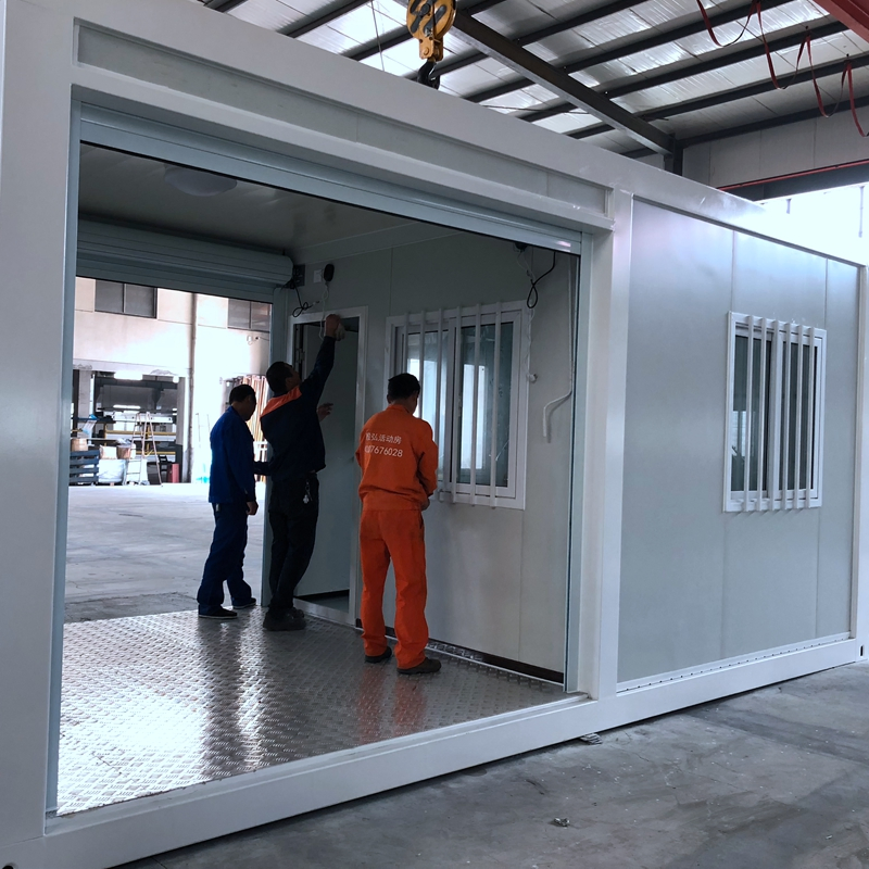 Low Cost Steel Modular Buildings Flat Pack Shipping Prefabricated Container House with Roller Shutter Door