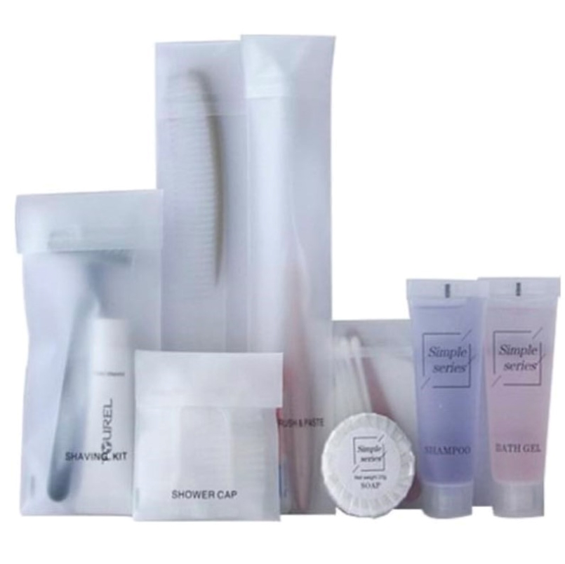 Toothbrush and Toothpaste in Plastic Packing with Hotel Amenities for Guest Room