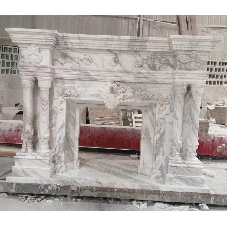 Каминный портал из белого мрамора с ручной резьбой