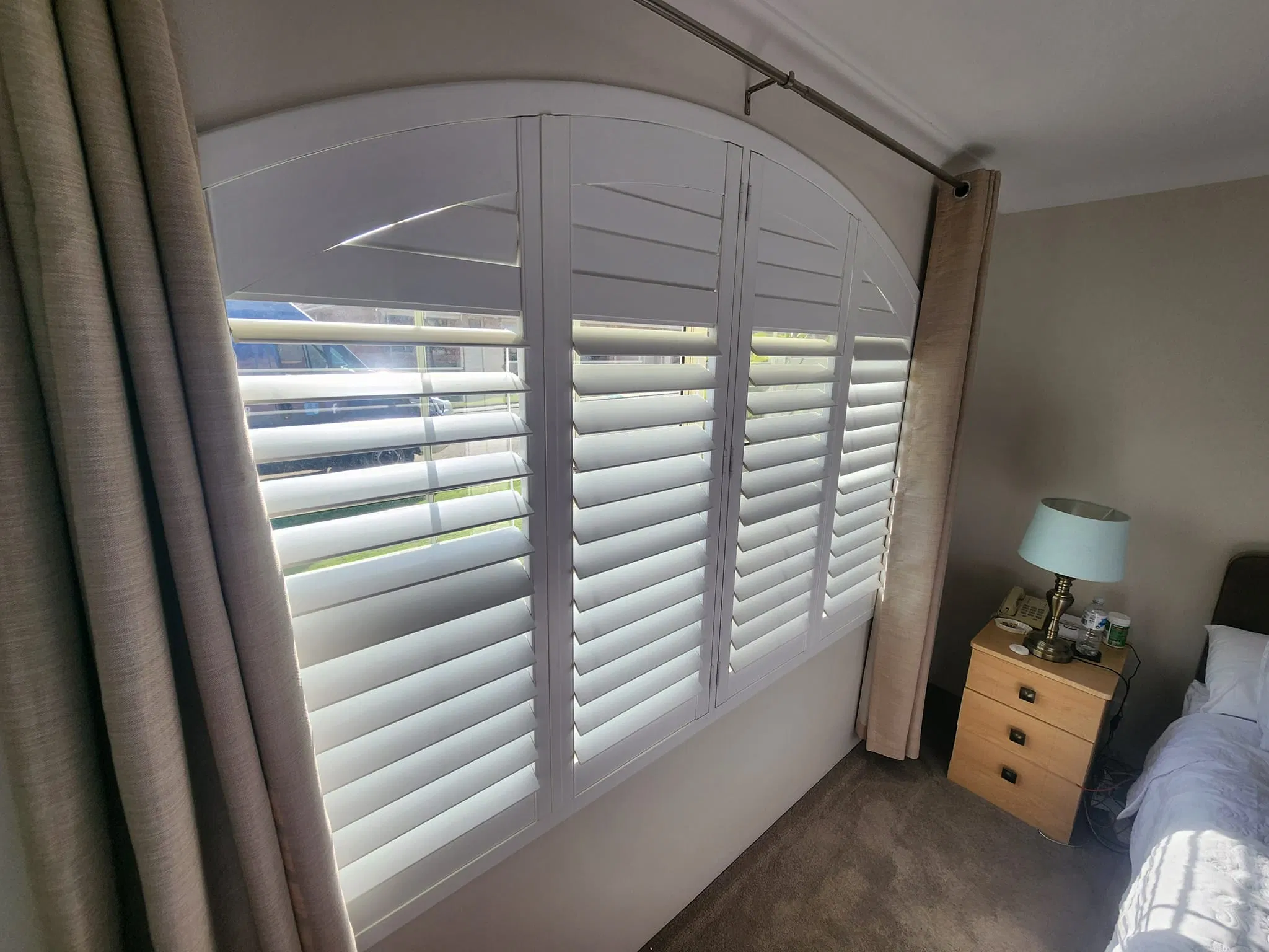 Beautiful Arch and Bay Window Plantation Shutter