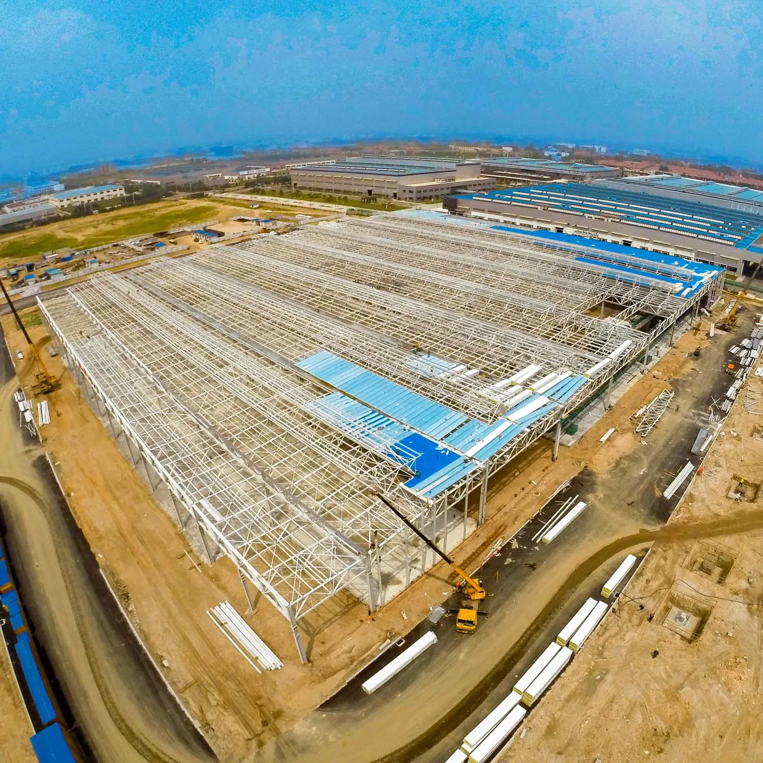 Large Clear Span Warehouse Workshop Bridge Playground Structural Steel Beam Column Fabrication