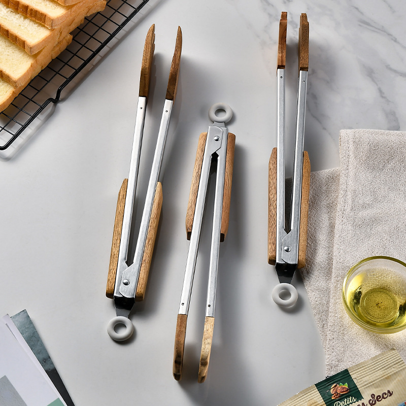 Acacia Wood Food Clip Is Palm Shaped Food Forceps, a Wooden Insulated Handle and a Stainless Steel Clip. It Is Easy to Master and Can Handle a Variety of Delica