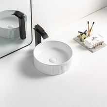 Черная круглая керамическая раковина для ванной