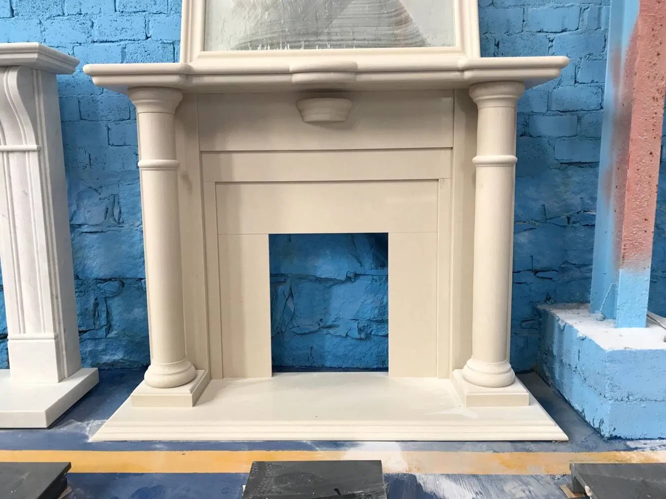 China Wholesale Interior Decoration Modern Style Hand Made Carved Artificial Stone Marble Fireplace Mantel Design Price