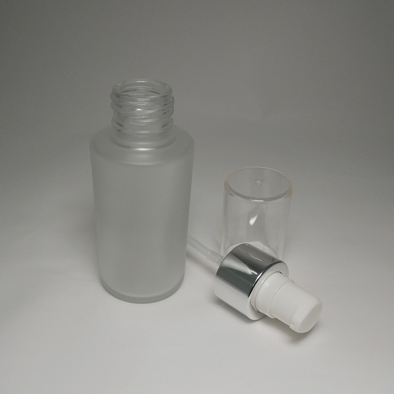 Luminous Silk Foundation 60ml Clear Glass Bottle with Plastic Pump Silver Collar
