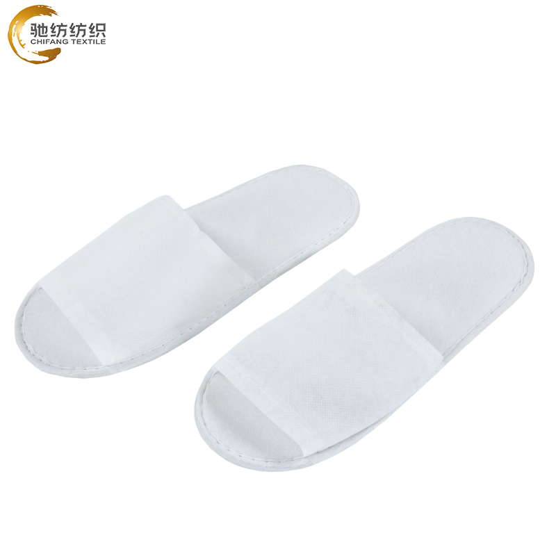 Eco Friendly Hotel Slipper with Spunlace and White Strip for Guest Room