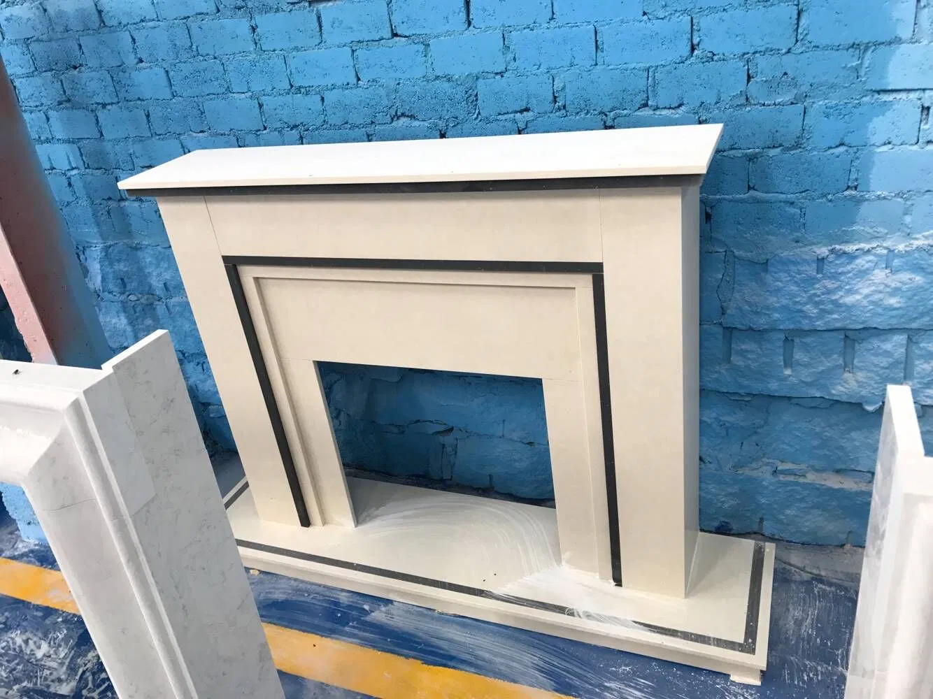 China Wholesale Interior Decoration Modern Style Hand Made Carved Artificial Stone Marble Fireplace Mantel Design Price