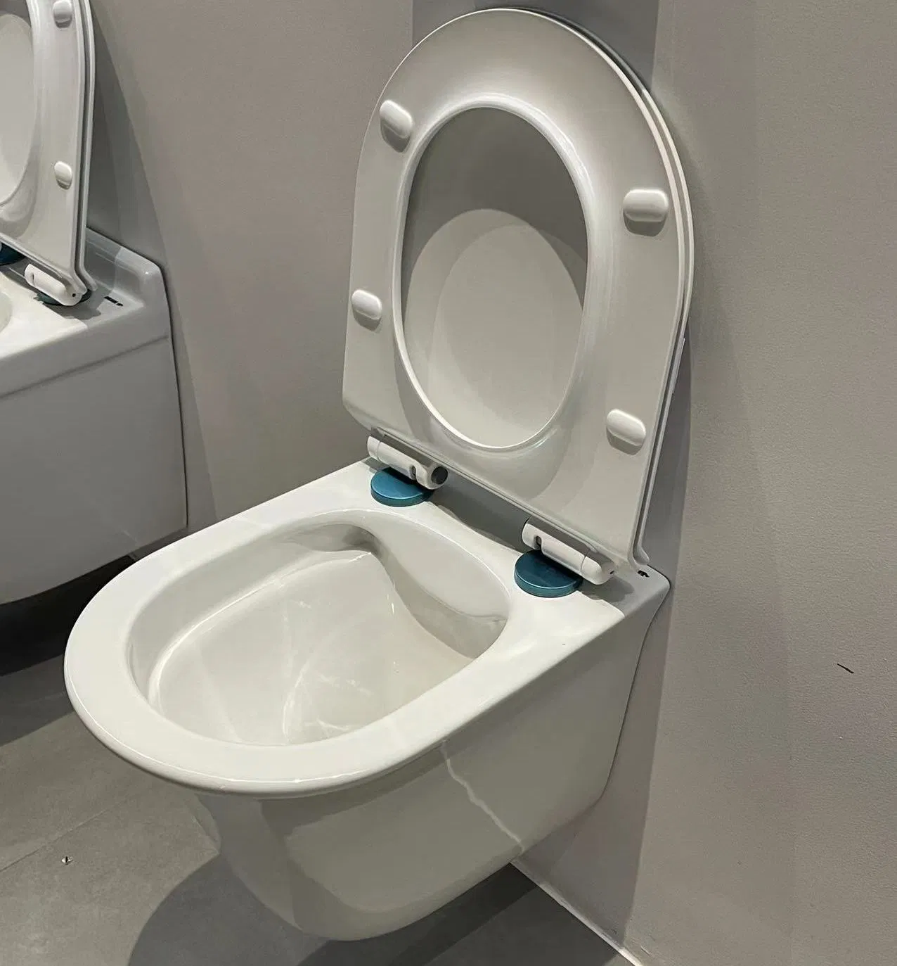 New Design Covered Bottom Hedging Ceramic Wall Hung Toilet for European Hotel