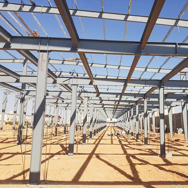 Design H Section Galvanized Metal Construction Prefab/Prefabricated Frame Industrial Building Workshop/Warehouse Steel Structure with Painted Sandwich Panel