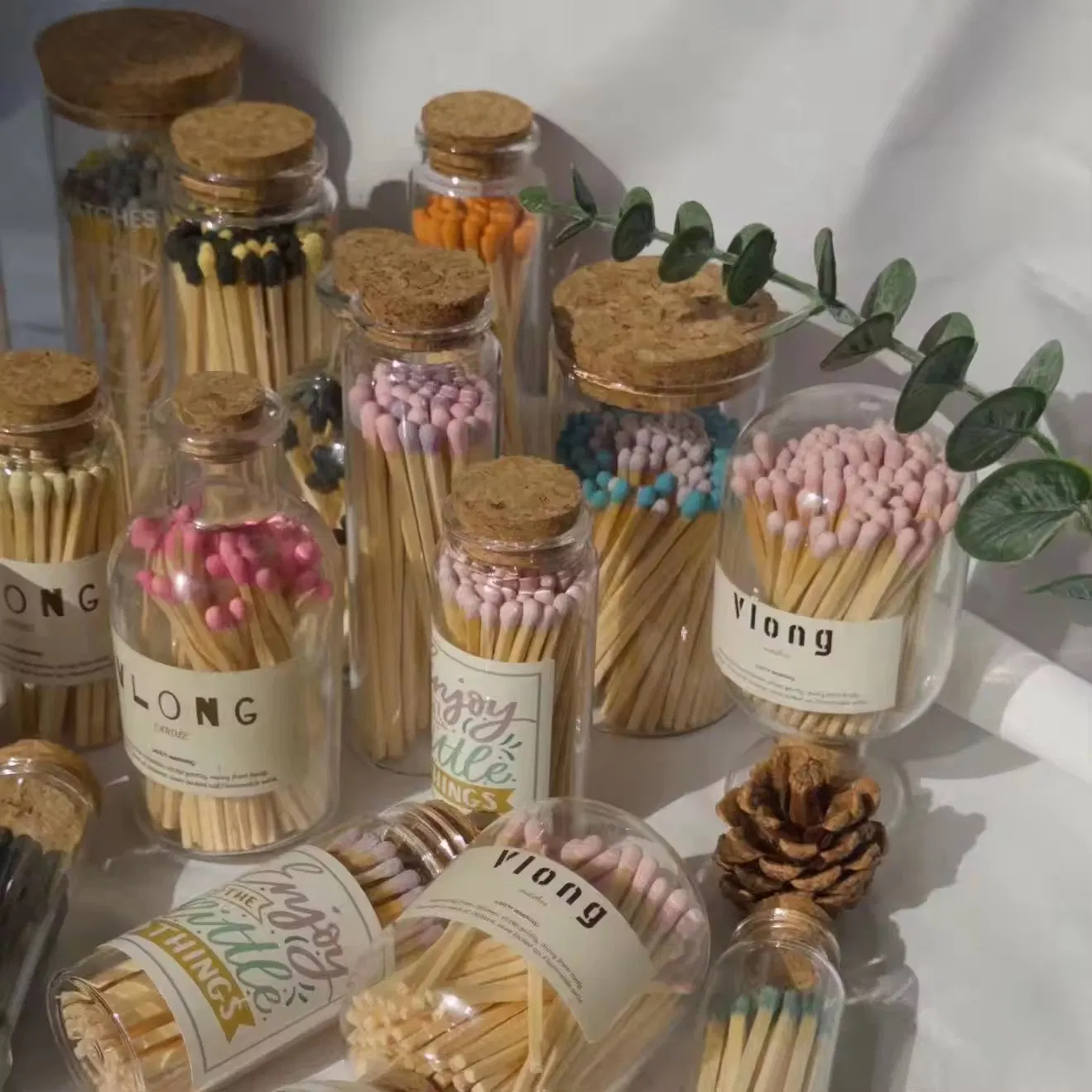 Elegant Glass Bottle Matches with Vibrant Colored Heads