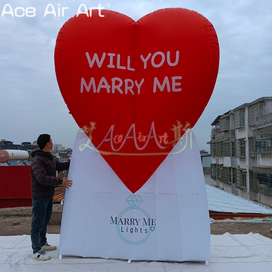 Custom-Designed Inflatable Red Heart with Text and White Base for Marriage Proposals.