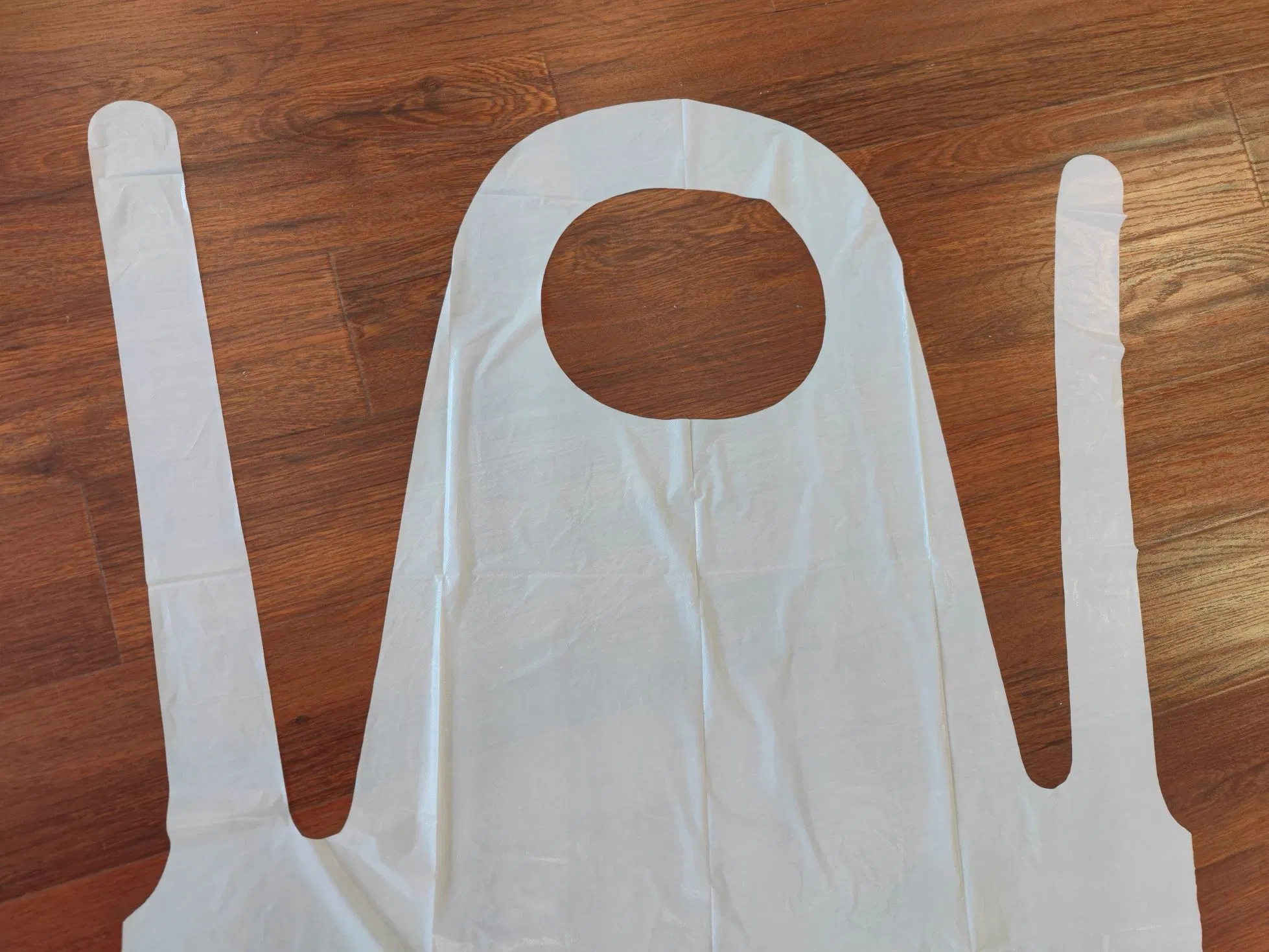 Custom Disposable PE LDPE HDPE Medical Water Proof Apron Custom Printed Logo Plastic Waterproof Disposable Aprons Manufacturers
