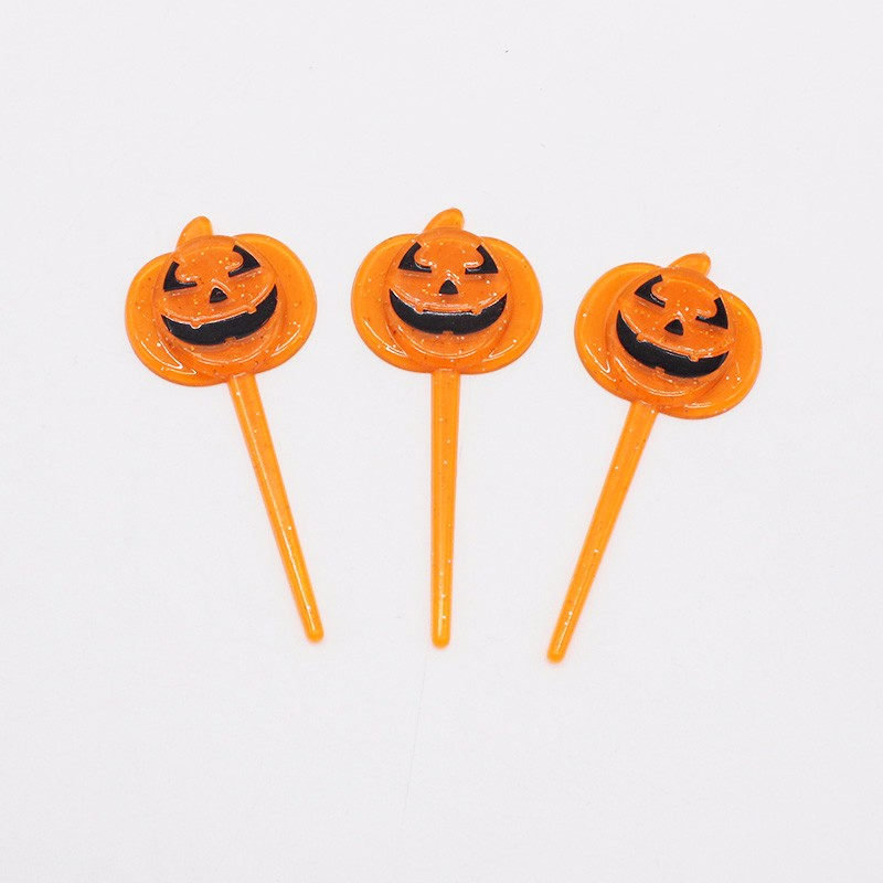 Vibrant Halloween Pumpkin Forks for Creative Fruit Serving