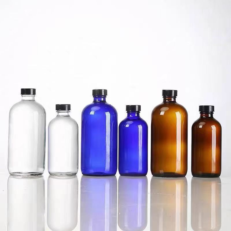 Амбровые стеклянные бутылки Boston Round с бакелитовой крышкой