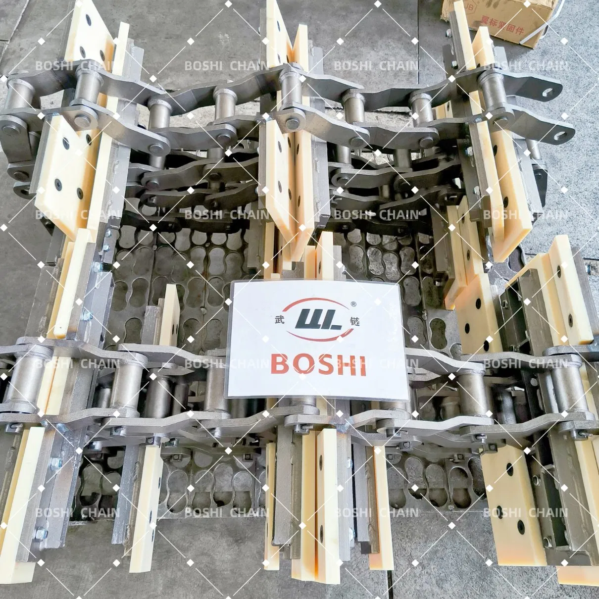Custom-Welded Bent Plate Chain with Molded Nylon Attachments for Forestry Material Conveyors