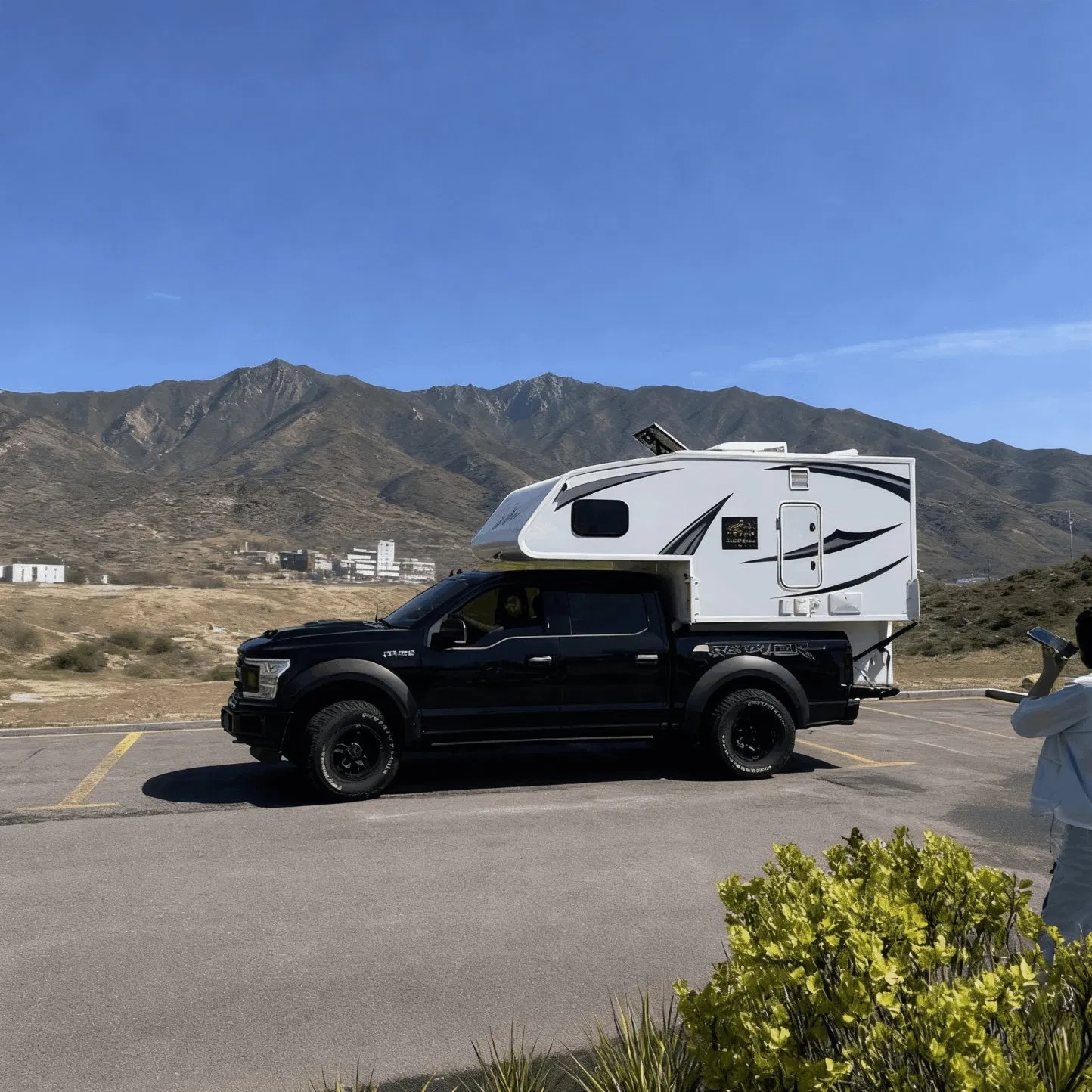 Hard Top Truck Camper Designed with a Dedicated Workspace and Satellite Internet Ready for Digital Nomads