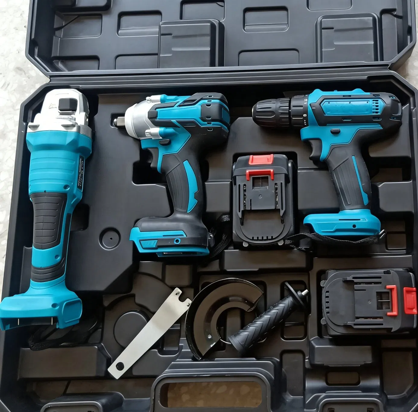 Versatile Power Tool Set: Drill, Impact Wrench, and Grinder
