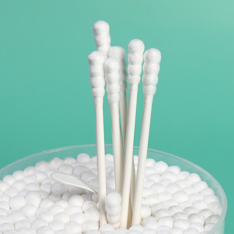 Portable Cotton Swabs with Cardboard Sticks in a Cylindrical Container.