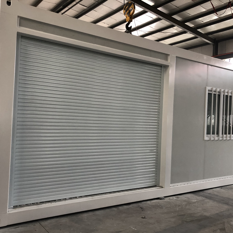 Low Cost Steel Modular Buildings Flat Pack Shipping Prefabricated Container House with Roller Shutter Door