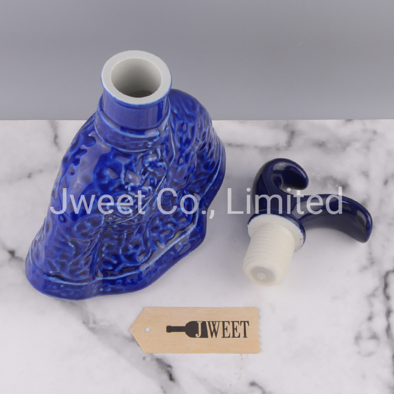 Irregular Shape Glazing Blue Embossed Porcelain Bottle for Wine