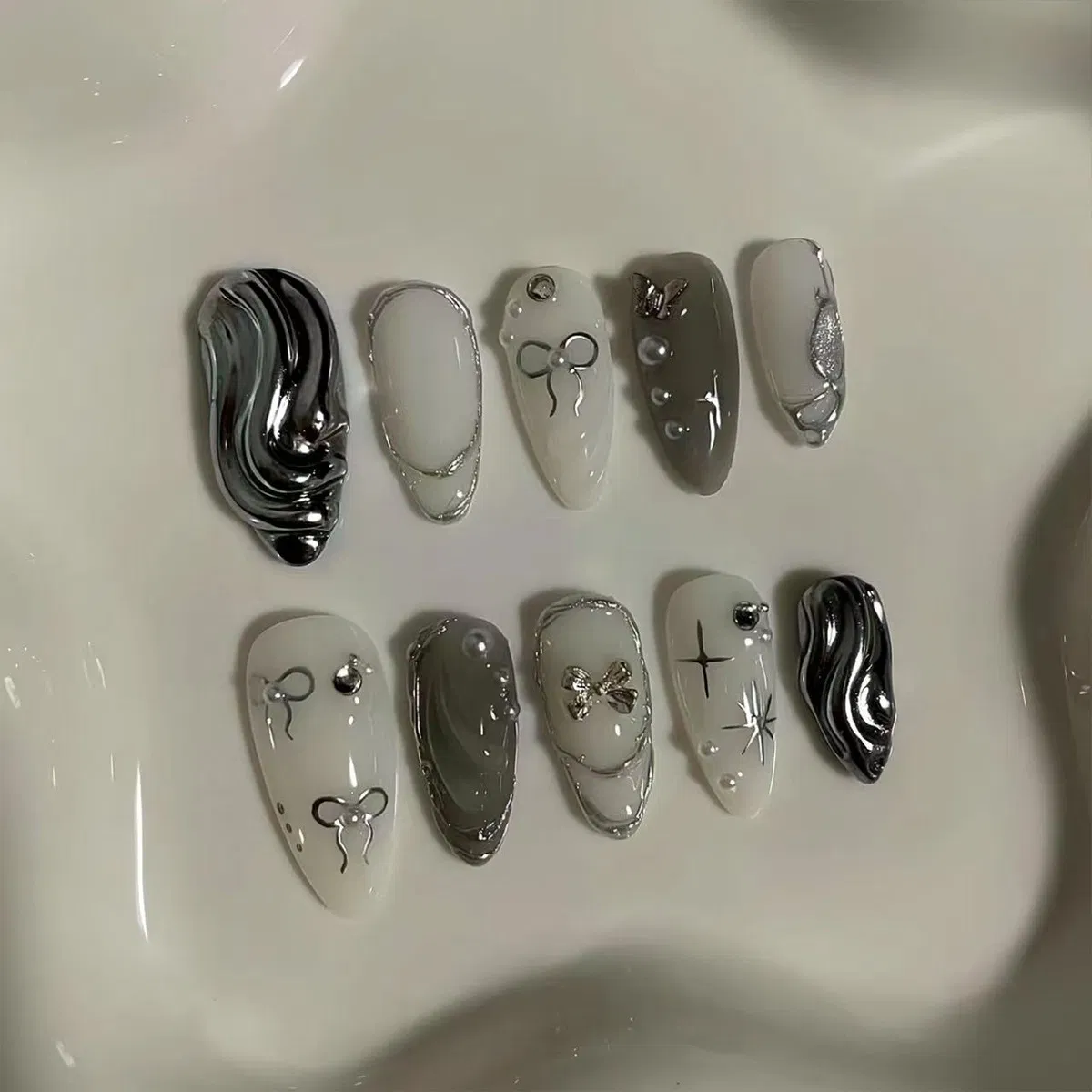 Cross-Border Hot Sale Almond Fake Nails 10PCS Textured Silver Bow Three-Dimensional Ripple Ins Style Wearable Nail Pieces