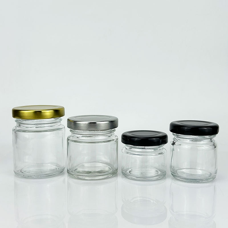 Hot Sale 50ml 80ml Mini Glass Jar Honey Jar Fashion Mason Jar Pickle Jam Honey Food Storage Round Empty Glass Jar with Metal Lid