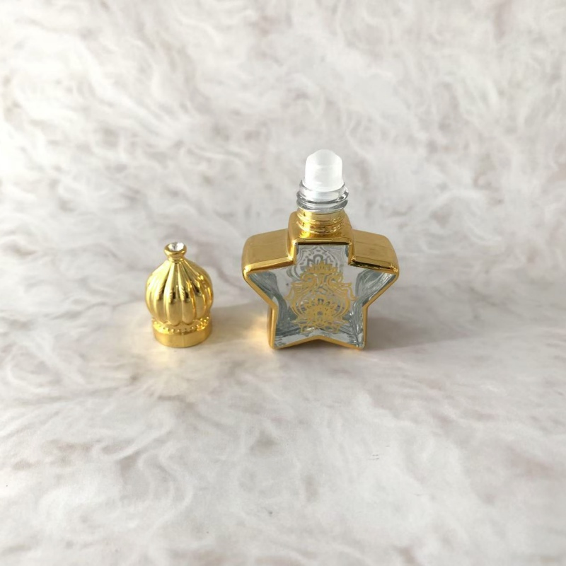 Hot Sell Portable Shiny Gold Glass Mini New Design Cosmetic Perfume Bottle with Roll on Ball