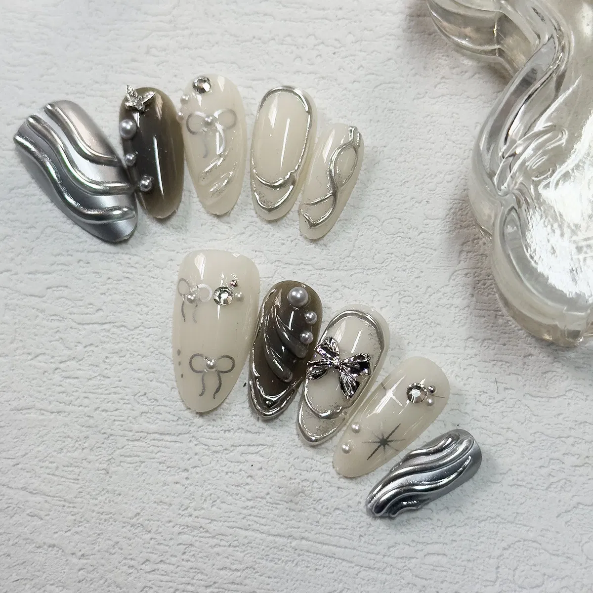 Cross-Border Hot Sale Almond Fake Nails 10PCS Textured Silver Bow Three-Dimensional Ripple Ins Style Wearable Nail Pieces