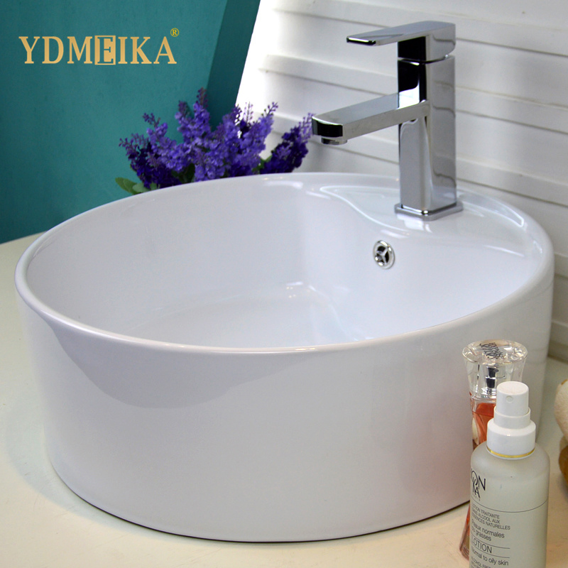 Круглая раковина для ванной с отверстием под кран