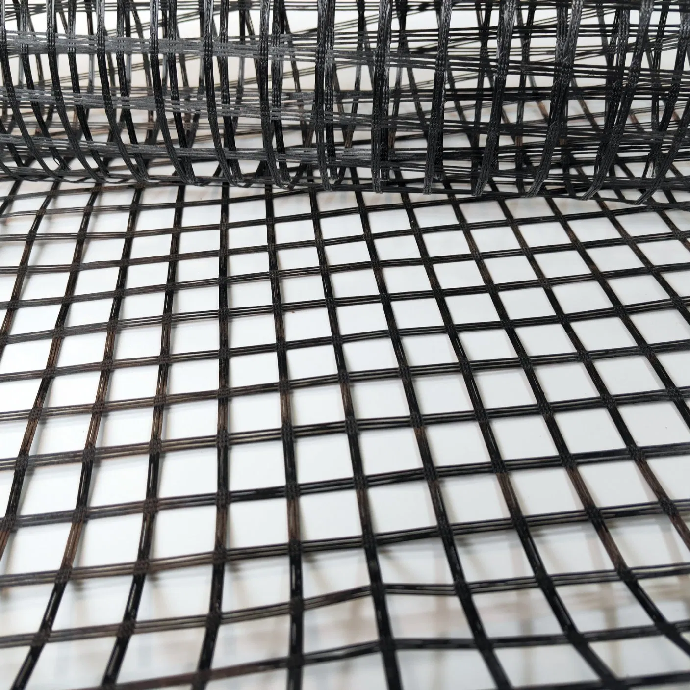 Fiberglass Geogrid 50/50kn 80/Kn 100/100kn Leading Manufacturer for Road Driveway