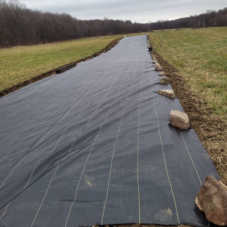 Grass Barrier Mat Landscape Fabric Ground Is Covered with The Grass Weed Barrier Fabric