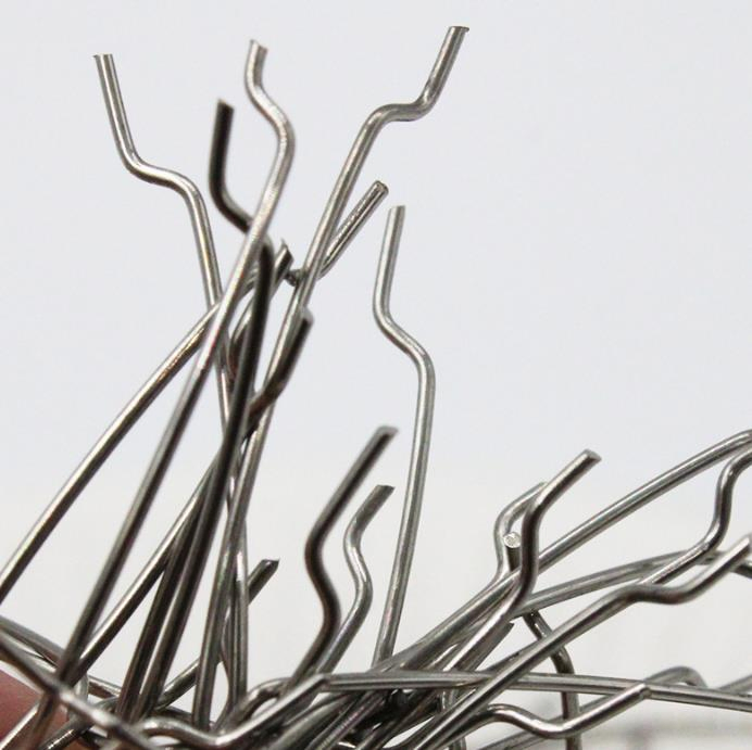 Crimped Steel Fiber with Enhanced Pullout Resistance for Shotcrete