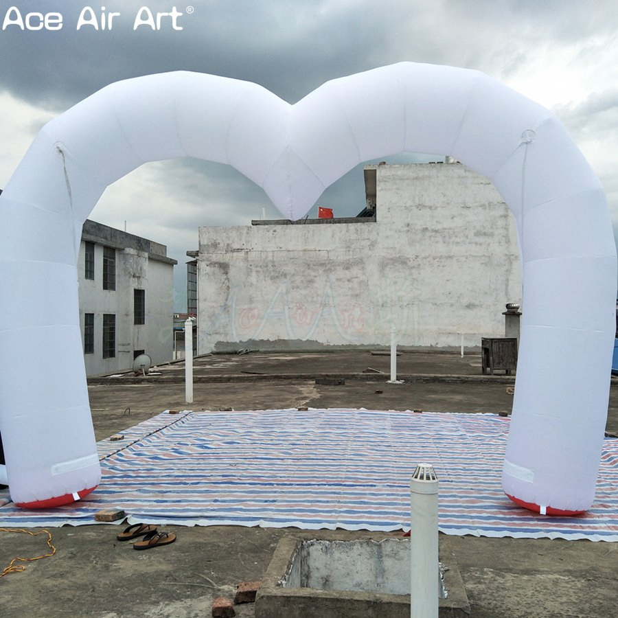 White Inflatable Heart-Shaped Arches for Valentine's Day and Wedding Decorations.