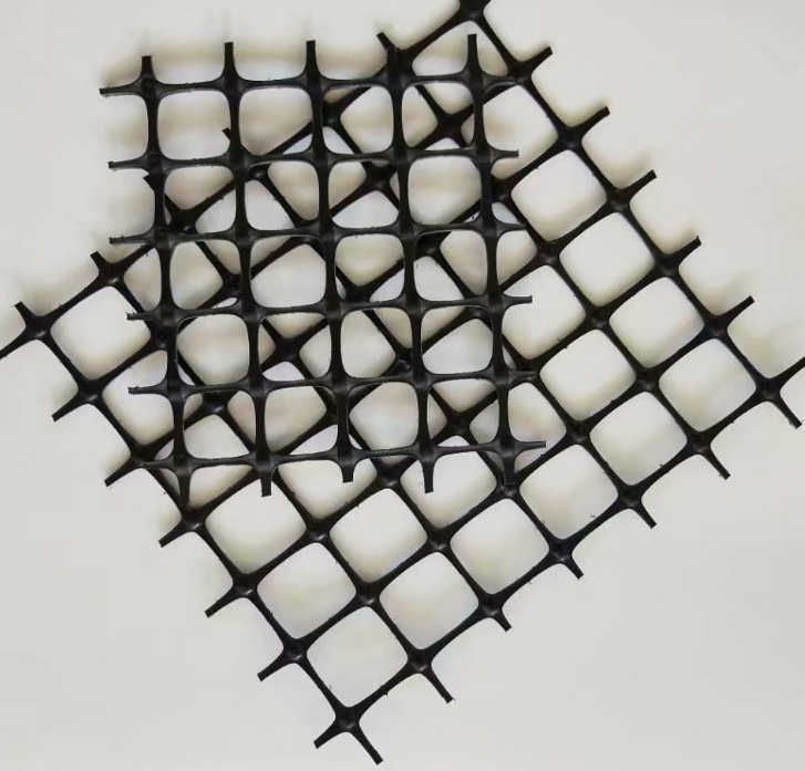 China Gravel Grid 20kN 30kN 40kN Biaxial PP/Polypropylene Plastic Geogrid for Road Reinforcement Low Price