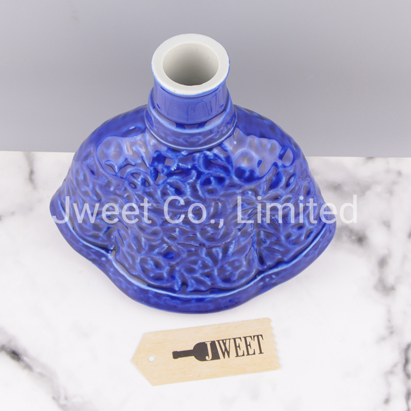 Irregular Shape Glazing Blue Embossed Porcelain Bottle for Wine