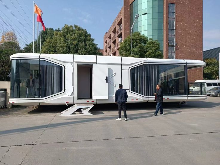 Futuristic Glass-Encased Living Pod with Galvanized Steel Frame