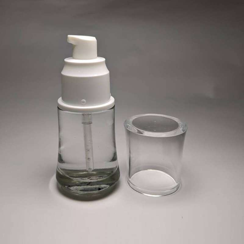 Cosmetic Skincare Packaging 50ml Cylinder Shape Glass Bottle Plastic Pump Transparent Cap