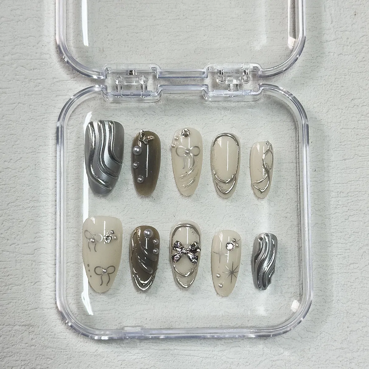 Cross-Border Hot Sale Almond Fake Nails 10PCS Textured Silver Bow Three-Dimensional Ripple Ins Style Wearable Nail Pieces