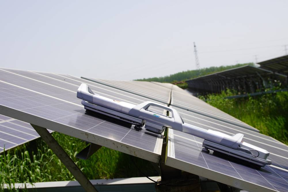 Robot for Solar Panels in Arid Area Applications with Dry-Sweep PV Cleaning Performance