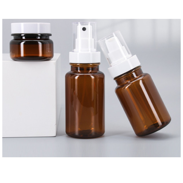 in Stock Lotion Pump Spray Make-up Packaging Bottles Transparent Tawny Plastic Round Spray Bottles