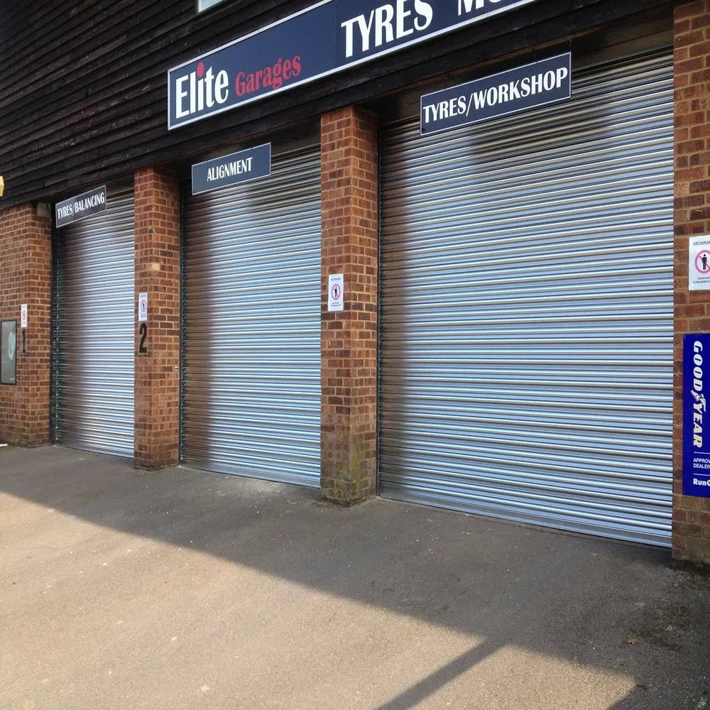 Industrial Automatic Wind-Resisting Rolling up Steel Roller Shutter Doors Optional with Perforated Ventilation Holes or Clear Windows for Factory or Warehouse