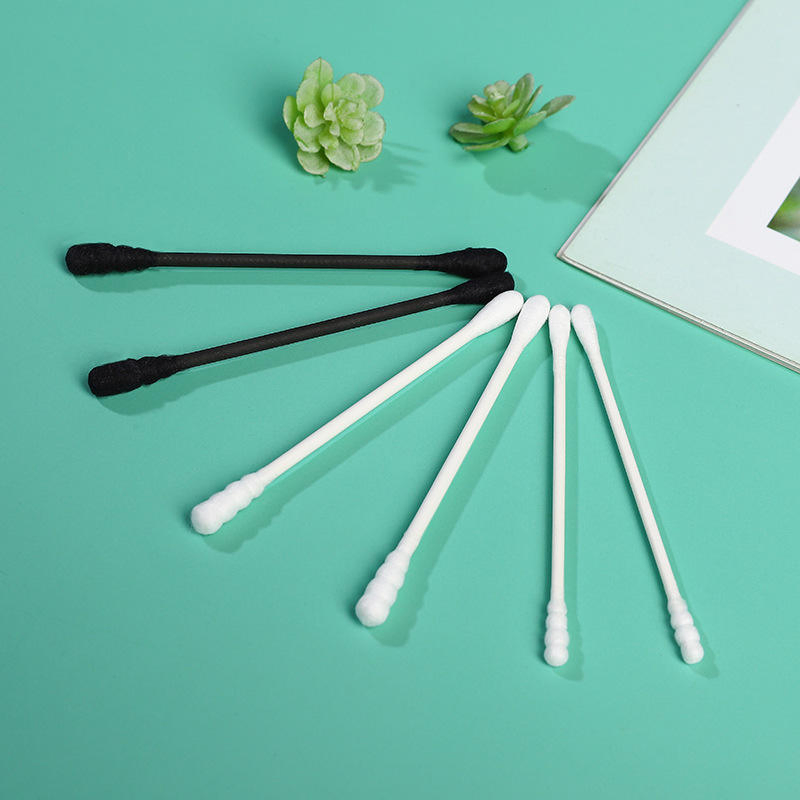 Portable Cotton Swabs with Cardboard Sticks in a Cylindrical Container.