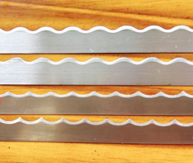 Scalloped Edge for Smooth Cutting in Fabric, Paper, or Leather Certain Plastics.