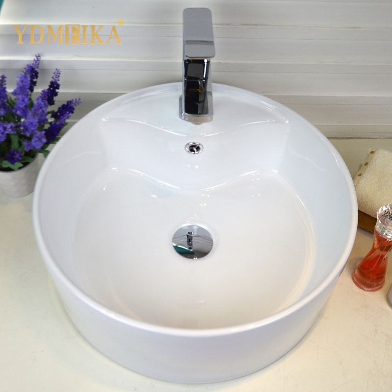 Круглая раковина для ванной с отверстием под кран