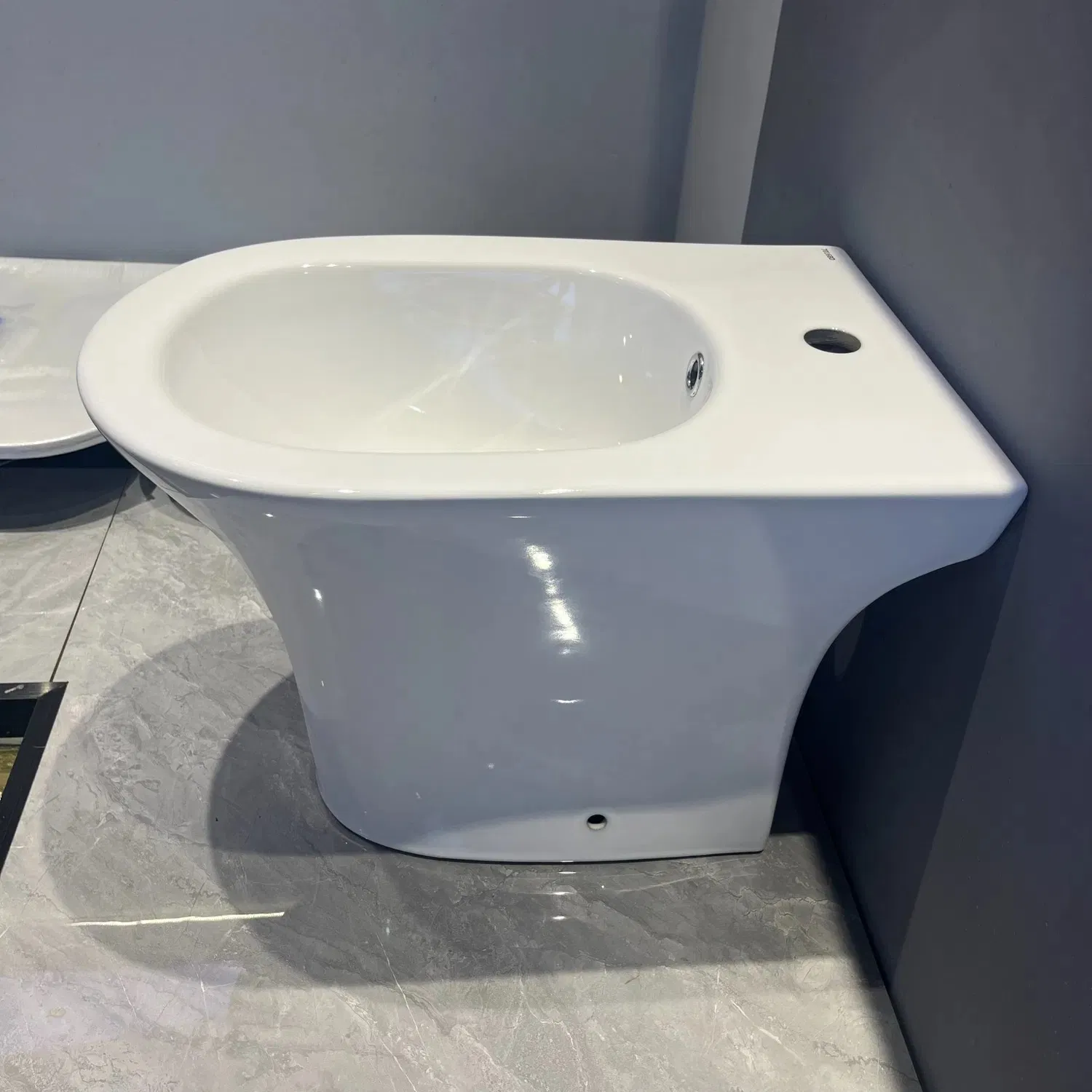 Hot Sale Bathroom Ceramic Round Shape Floor Mounted Back to Wall Bidet