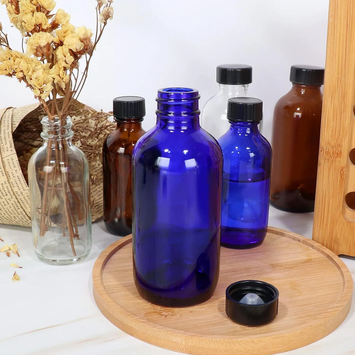 Стеклянные бостонские бутылки синие с черной крышкой